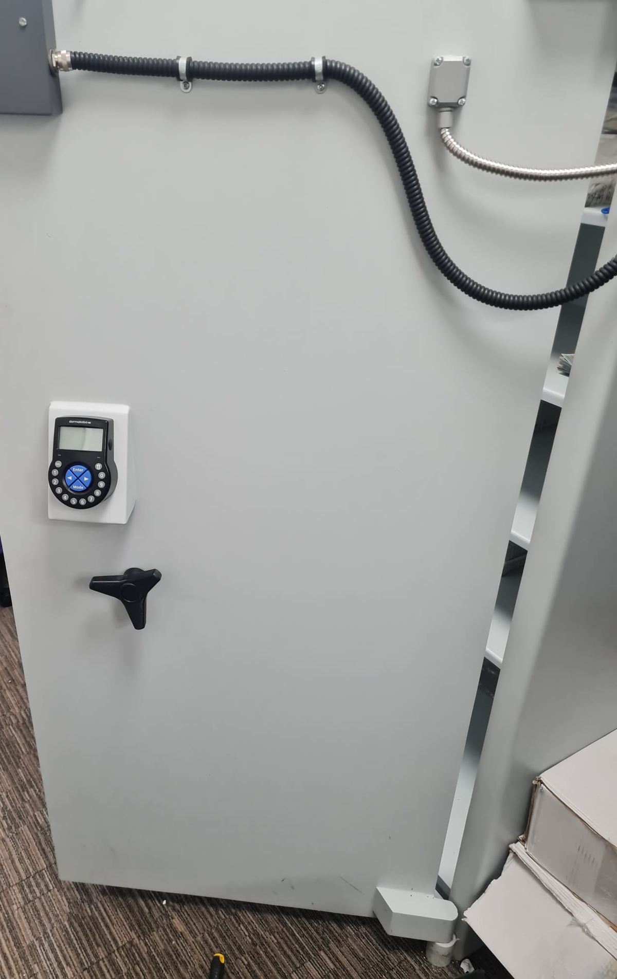A strongroom door fitted with an electronic combination lock.